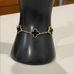 Elegant Gold and Black Clover Bracelet